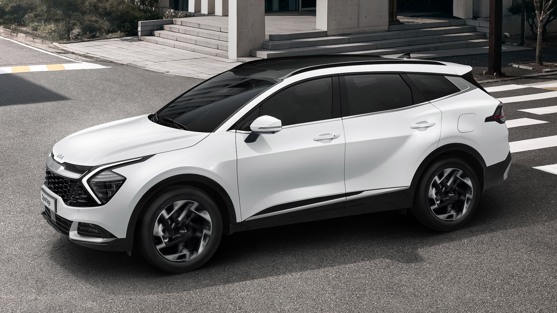 Groupe beaucage kia Sportage 2023 blanc en ville vue de profil